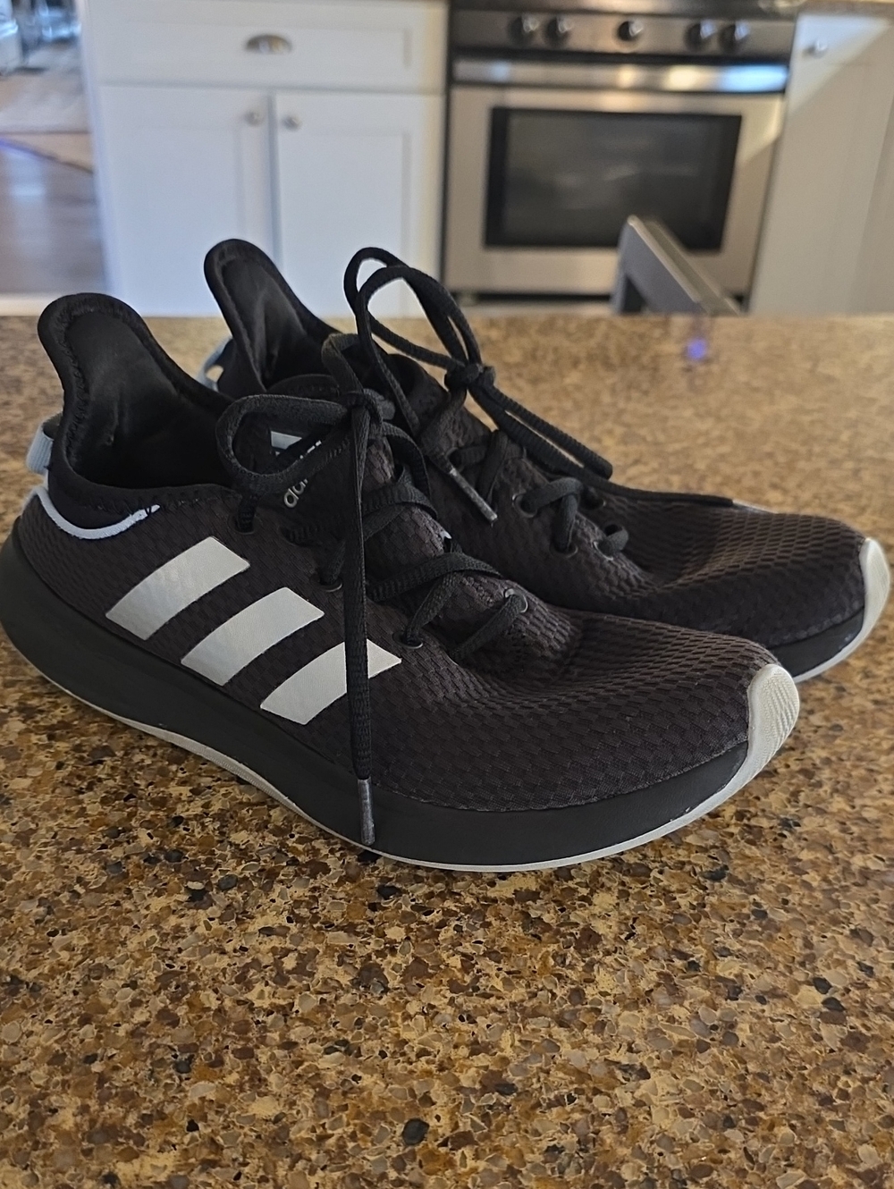 adidas Women’s Black Athletic Sneakers with White Stripes